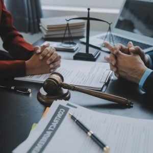 justice-law-conceptmale-judge-courtroom-with-gavel-working-with-computer-docking-keyboard-eyeglasses-table-morning-light_265022-67068
