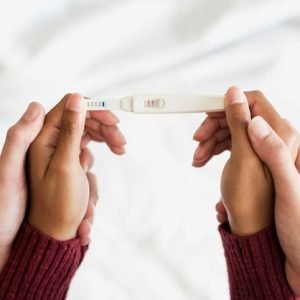 woman-holding-positive-pregnancy-test_53876-7275